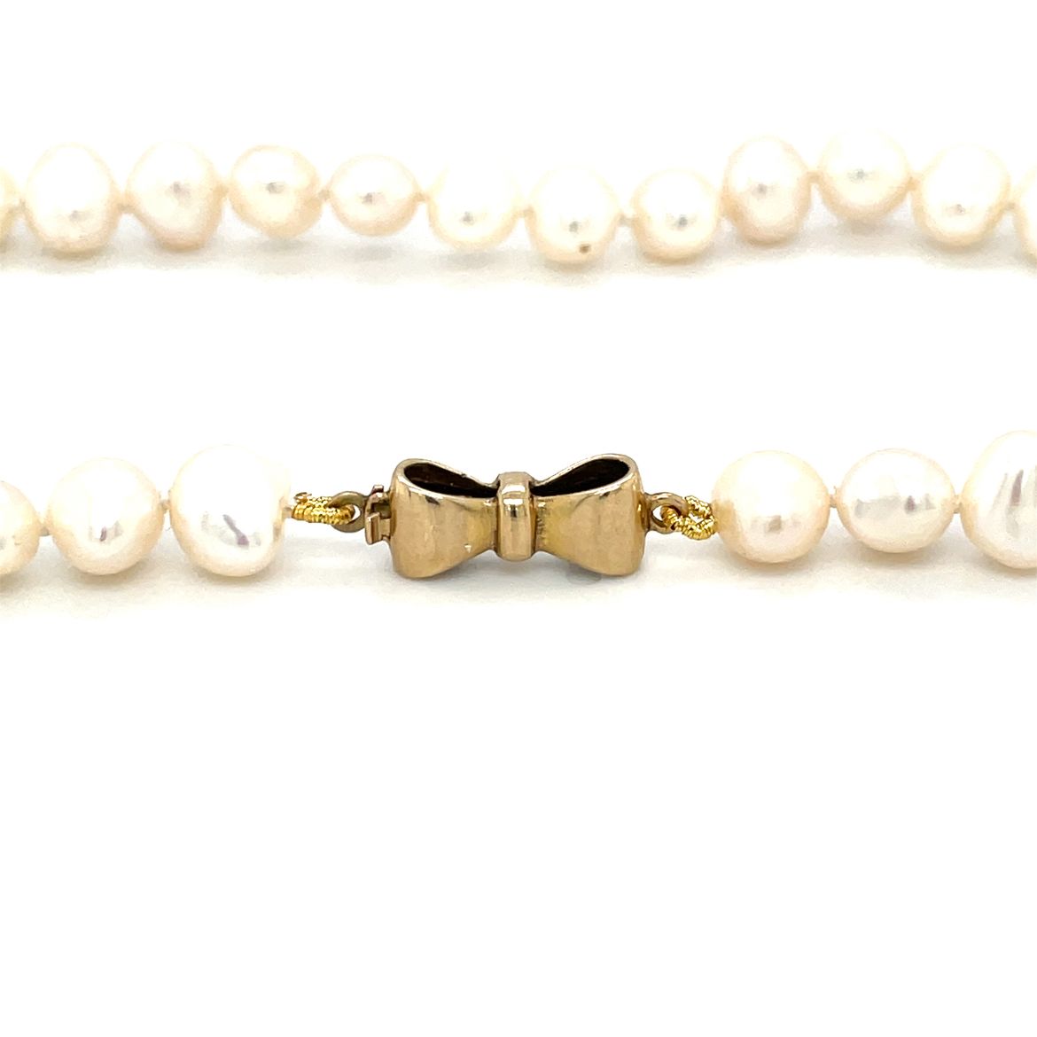 17 inch fresh water 6-6.5mm "potato" pearl necklace on a 9ct yellow gold bow style clasp