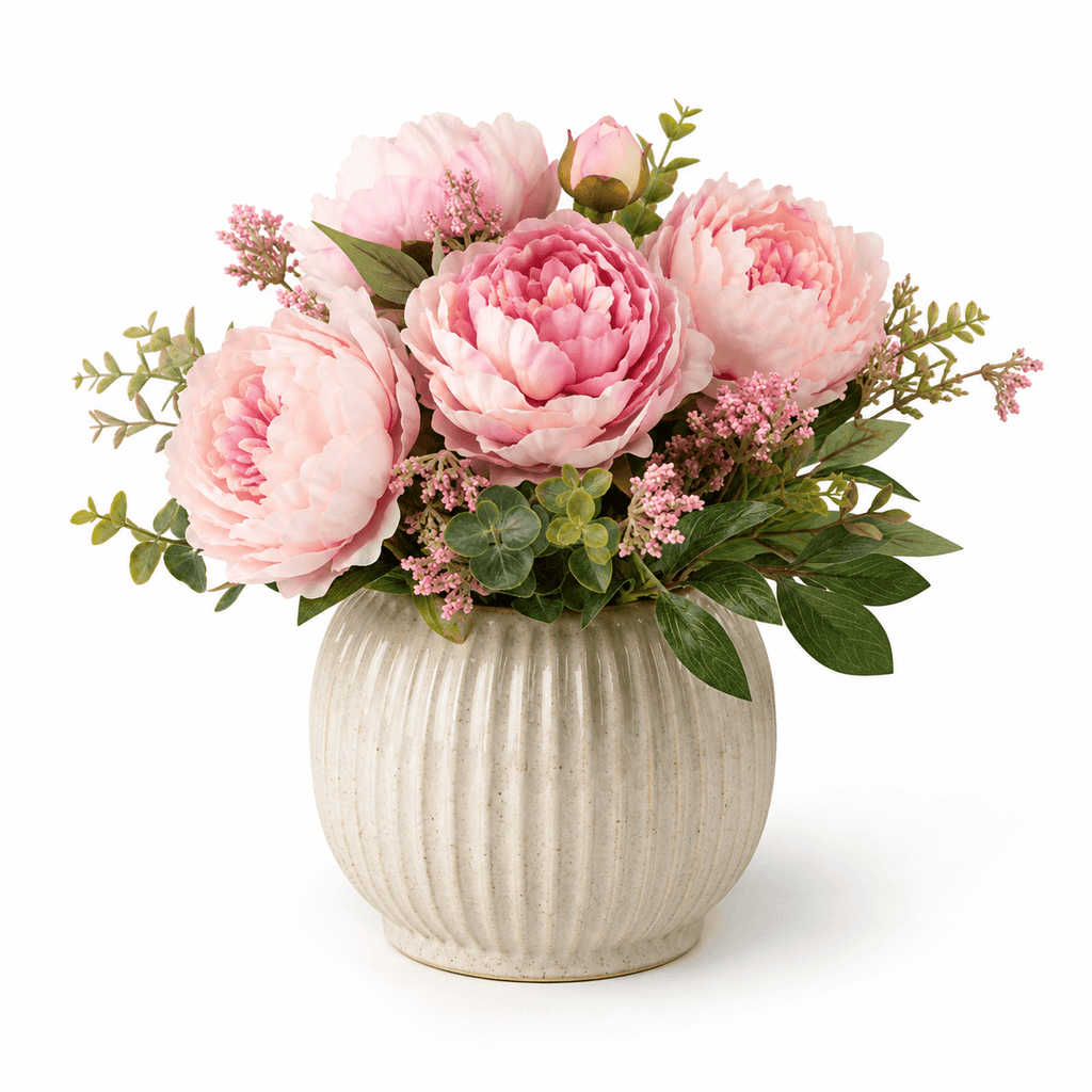 Vase with pink flowers on a white background