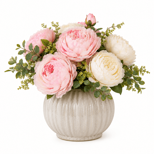Floral arrangement with pink and white flowers in a textured vase on a white background